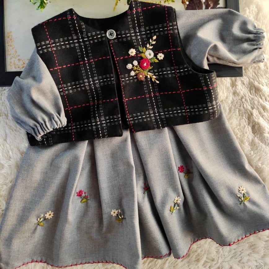 Floral detail on the plaid jacket